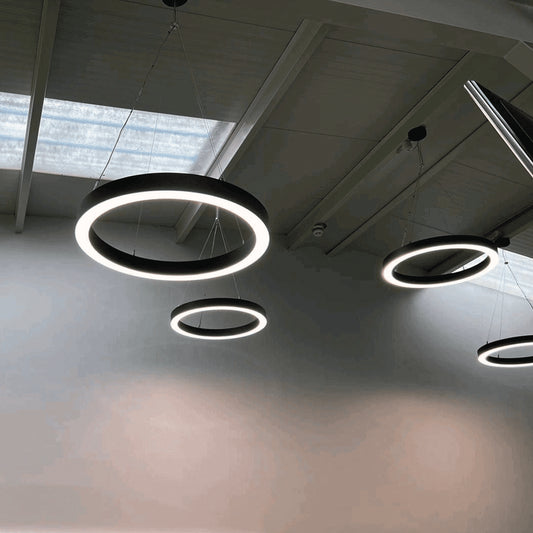 LED Bi-directional halo ceiling pendant light fittings installed together.