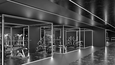 A stylish monochrome gym with linear lights running throughout.