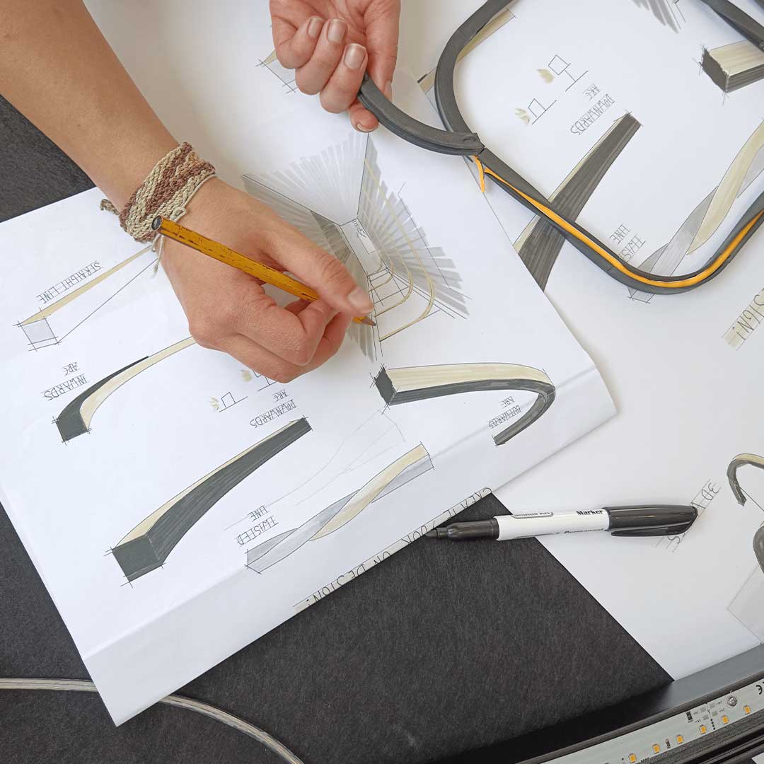 Lighting designer at work sketching and designing lighting solutions.