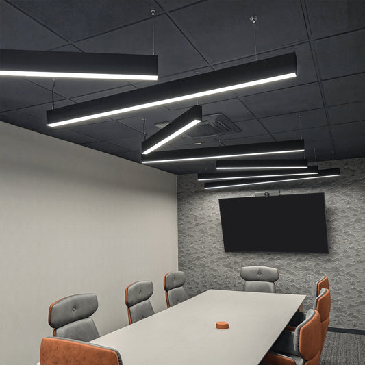 Installed PROLine black linear LED lights in an office above a conference room table