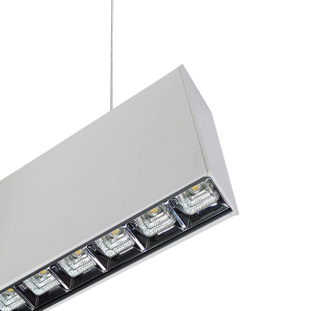 Close-up of white square optics on PROLine linear LED suspended light showing precision optics