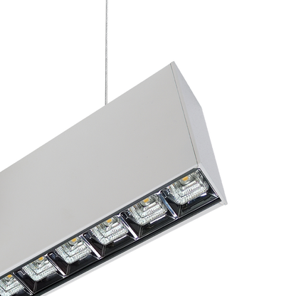 Close-up of white square optics on PROLine linear LED suspended light showing precision optics